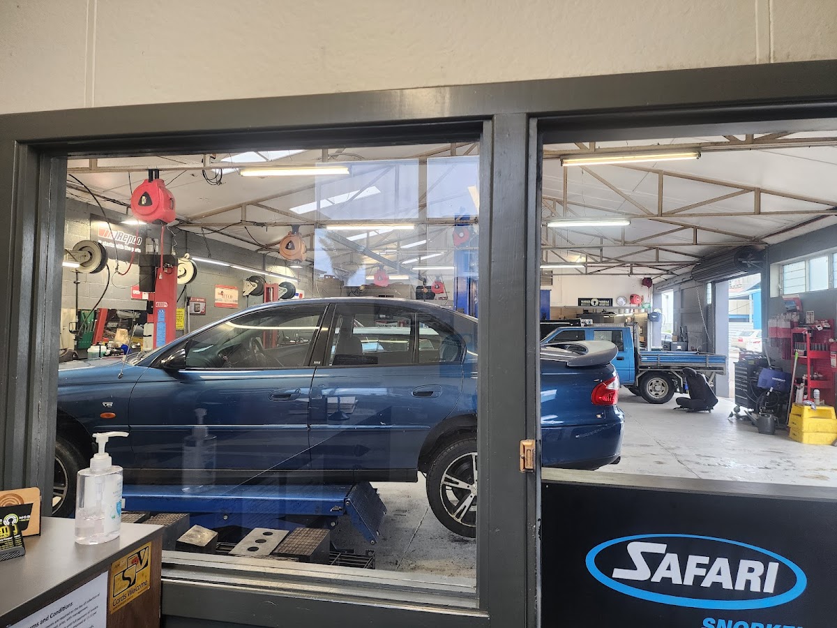 A car up on the hoist in the Campbells Auto Repairs workshop